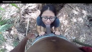 Black man and Asian woman couple fucking outside in wilderness amateurs