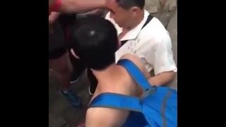 Chinese boy play with older men outdoor