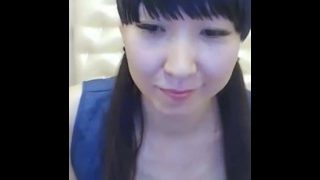 Sexy Chinese girl opens mouth, crosses eyes, and shows feet